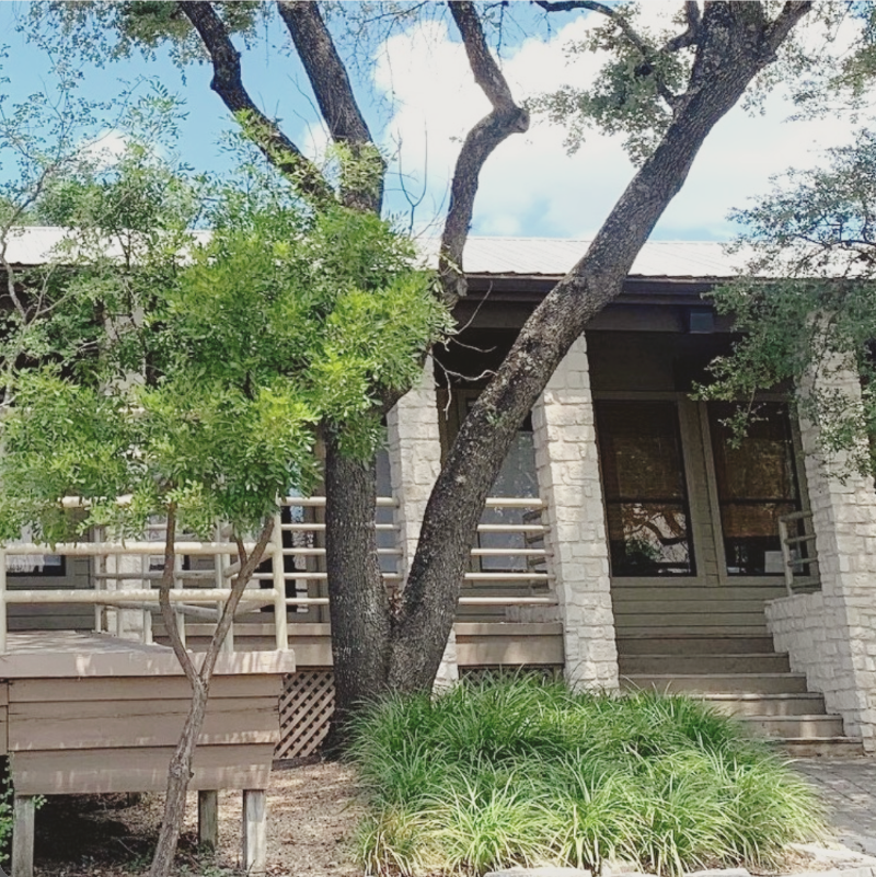 Susan Gonzales & Associates Counseling Exterior Outside view of Susan Gonzales and Associate Counseling office. The building is limestone and is surrounded by trees and plants.